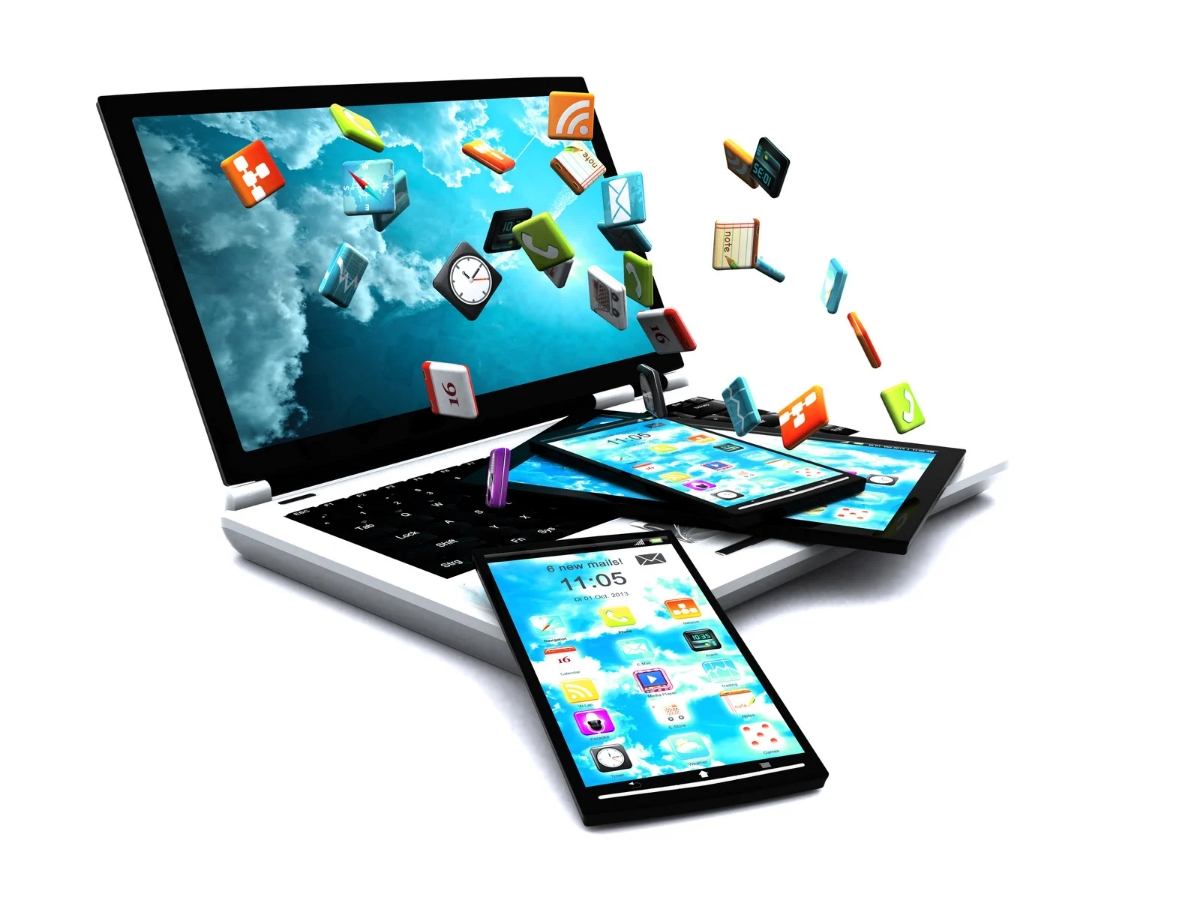 Laptop and mobile devices with apps emerging, representing modern web application development in Kerala