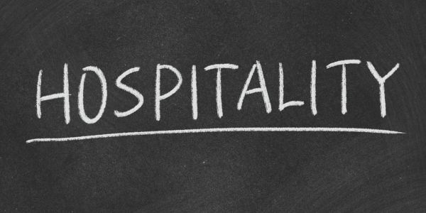 The word “Hospitality” written on a blackboard in white chalk, representing the growing importance of Digital Marketing Services in India for the hospitality industry.