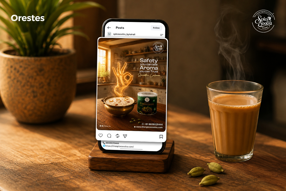 Spice Sootra cardamom social media post displayed on a smartphone beside a steaming cup