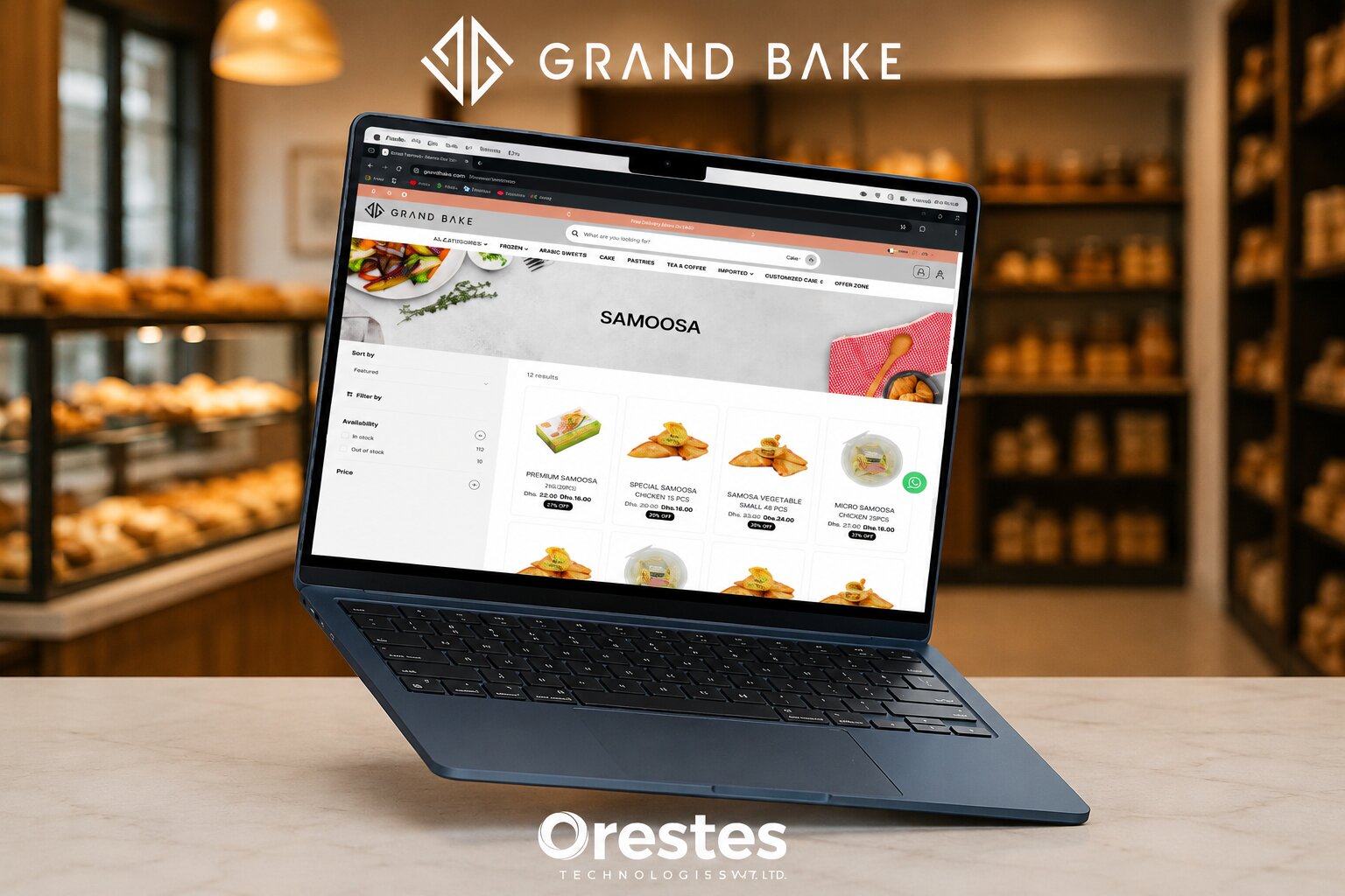 A sleek blue laptop displaying the e-commerce website interface of Grand Bake on a marble counter, set against a blurred bakery background. The Orestes Technologies Pvt. Ltd. logo is visible at the bottom.